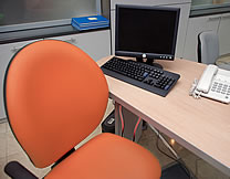 orange office chair and workstation